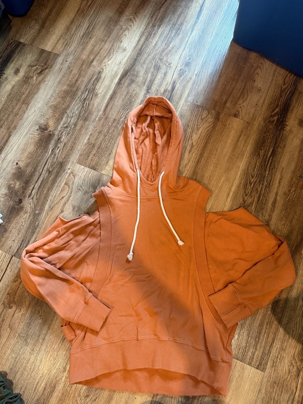 Rust Orange Hooded Sweatshirt with Drawstrings and Shoulder Cutouts